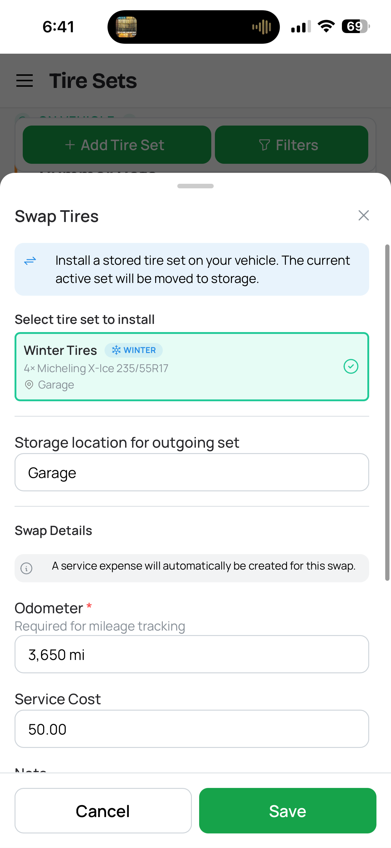 Tire swap bottom sheet drawer with: 'Swap tires' title at top, a dropdown to select the stored set to install showing 'Winter 2023 Nokian', the currently active set shown as 'Summer 2024 Michelin → will move to Storage', a date picker field, an odometer input field, and optional fields for service location (with auto-detect) and price. A 'Confirm Swap' accent-colored button at the bottom.